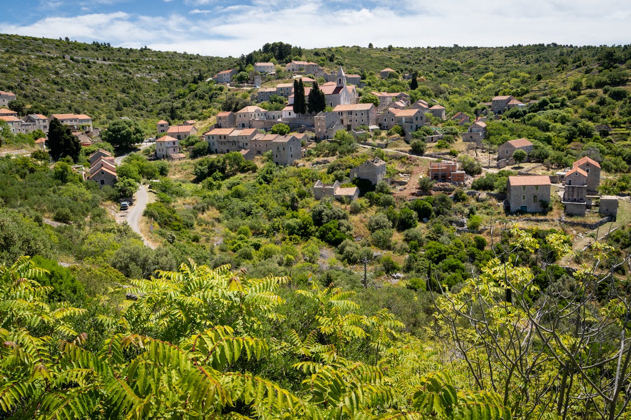 Crafting Captivating Headlines: Your awesome post title goes here Explore a picturesque traditional village nestled in the green hills of Split-Dalmatia, Croatia.
